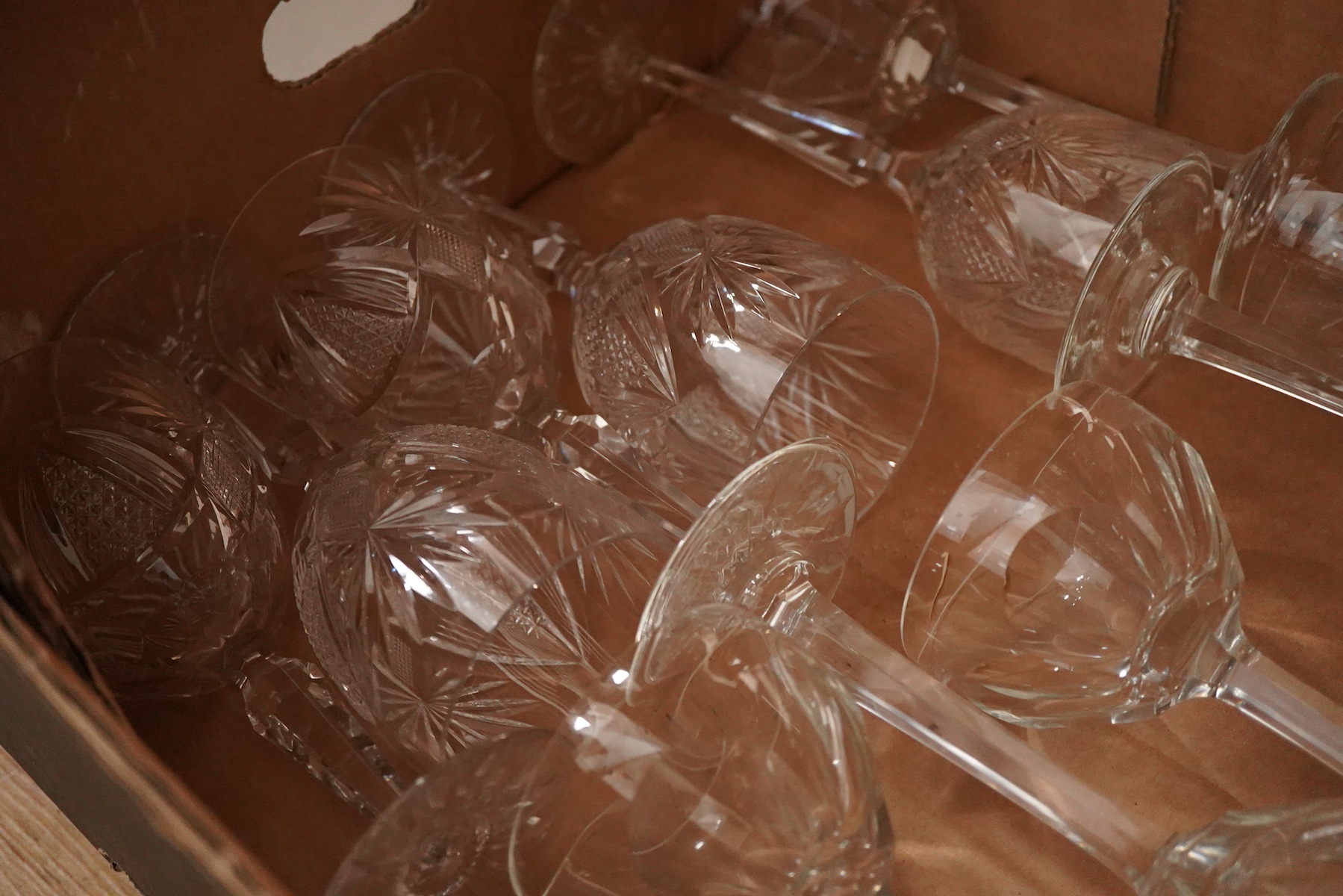 A mixed collection of cut glass wine glasses, spirit and other drinking glasses etc